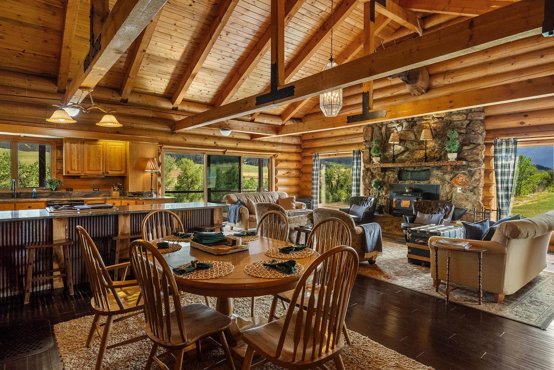 luxury log home interior with stone fireplace for sale montana two rivers lodge