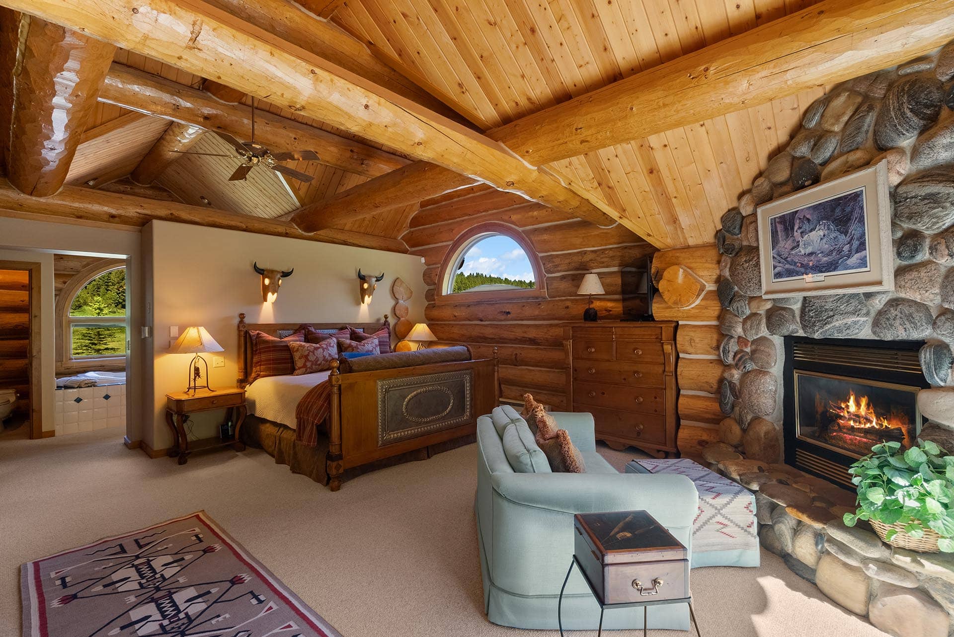 master bedroom with fireplace for sale montana gallatin riverfront retreat in big sky