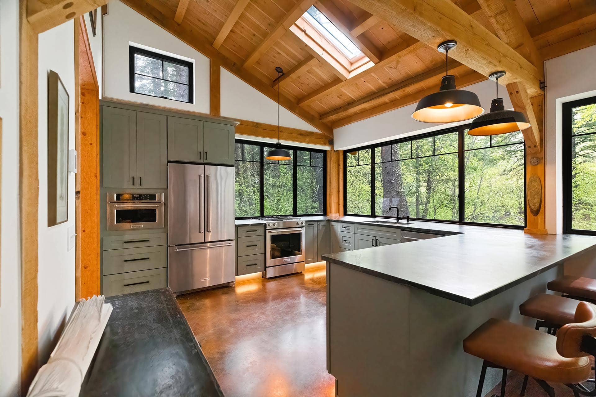 modern kitchen with forest views and skylight for sale montana bozeman creekside hideaway