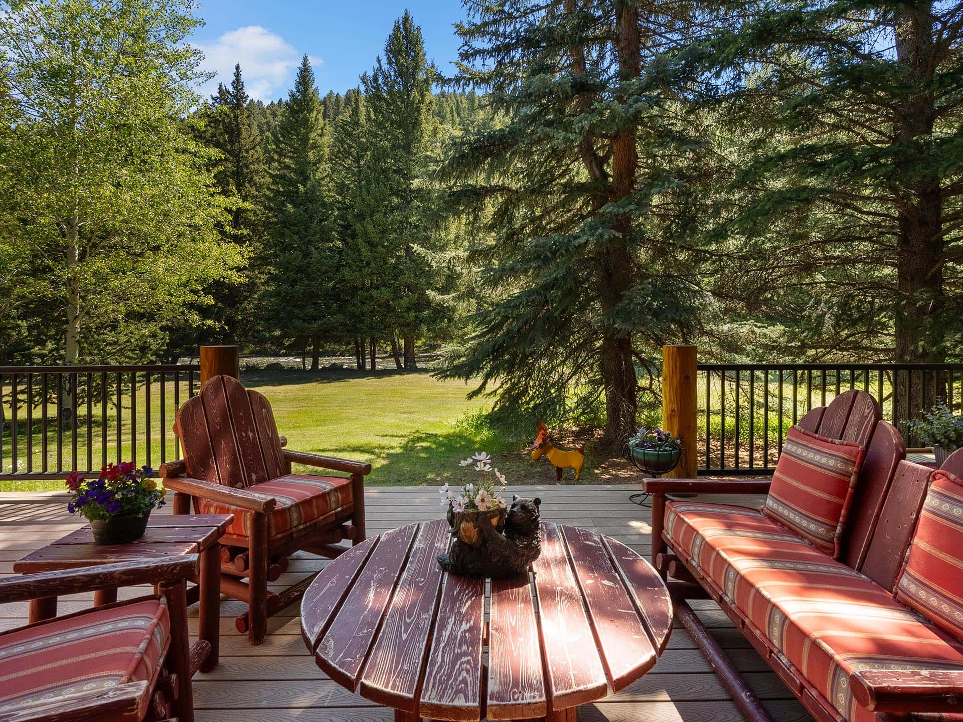 outdoor living deck with river view montana gallatin riverfront retreat in big sky