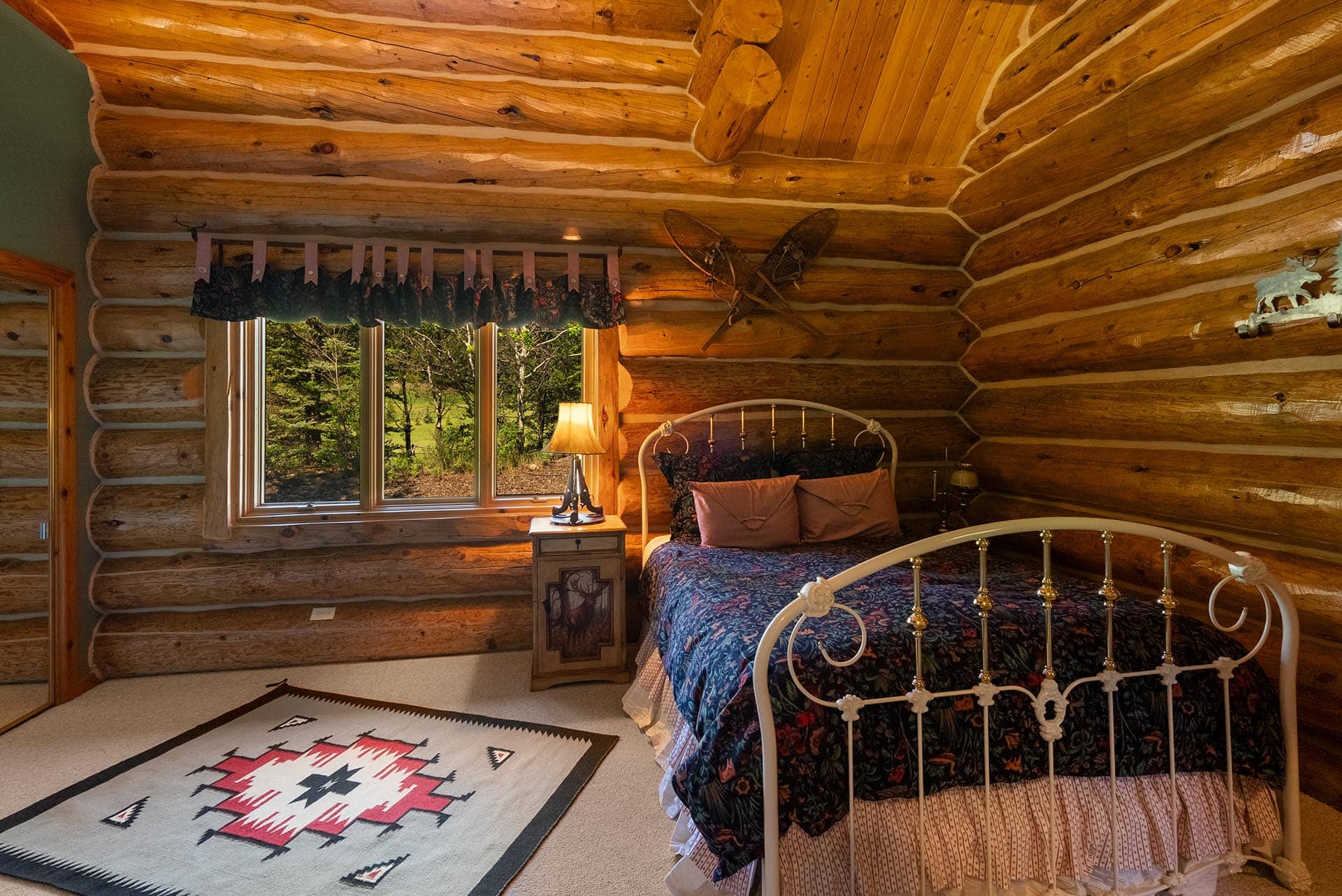 rustic log home bedroom interior montana gallatin riverfront retreat in big sky
