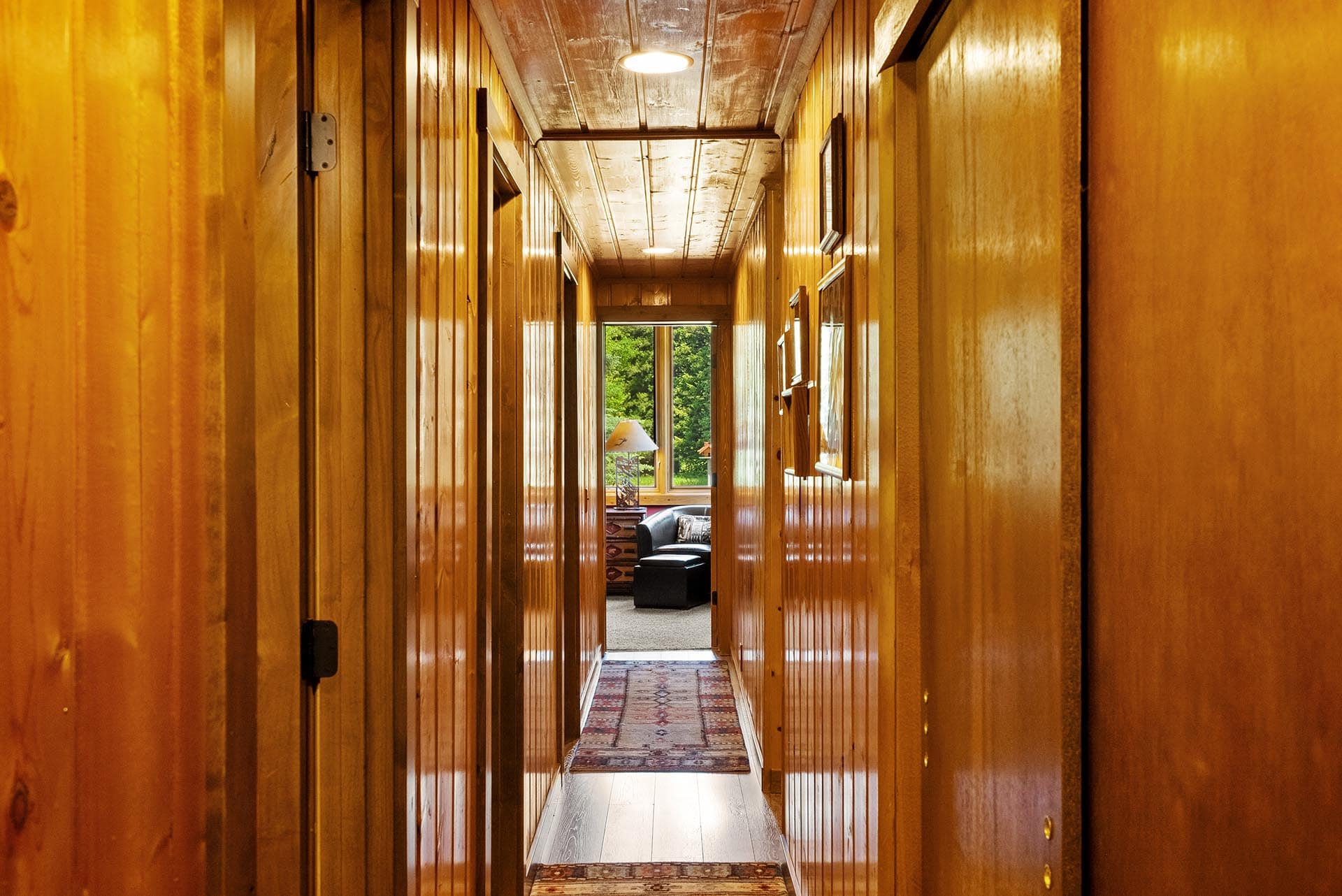 wood paneled interior hallway montana gallatin riverfront retreat in big sky