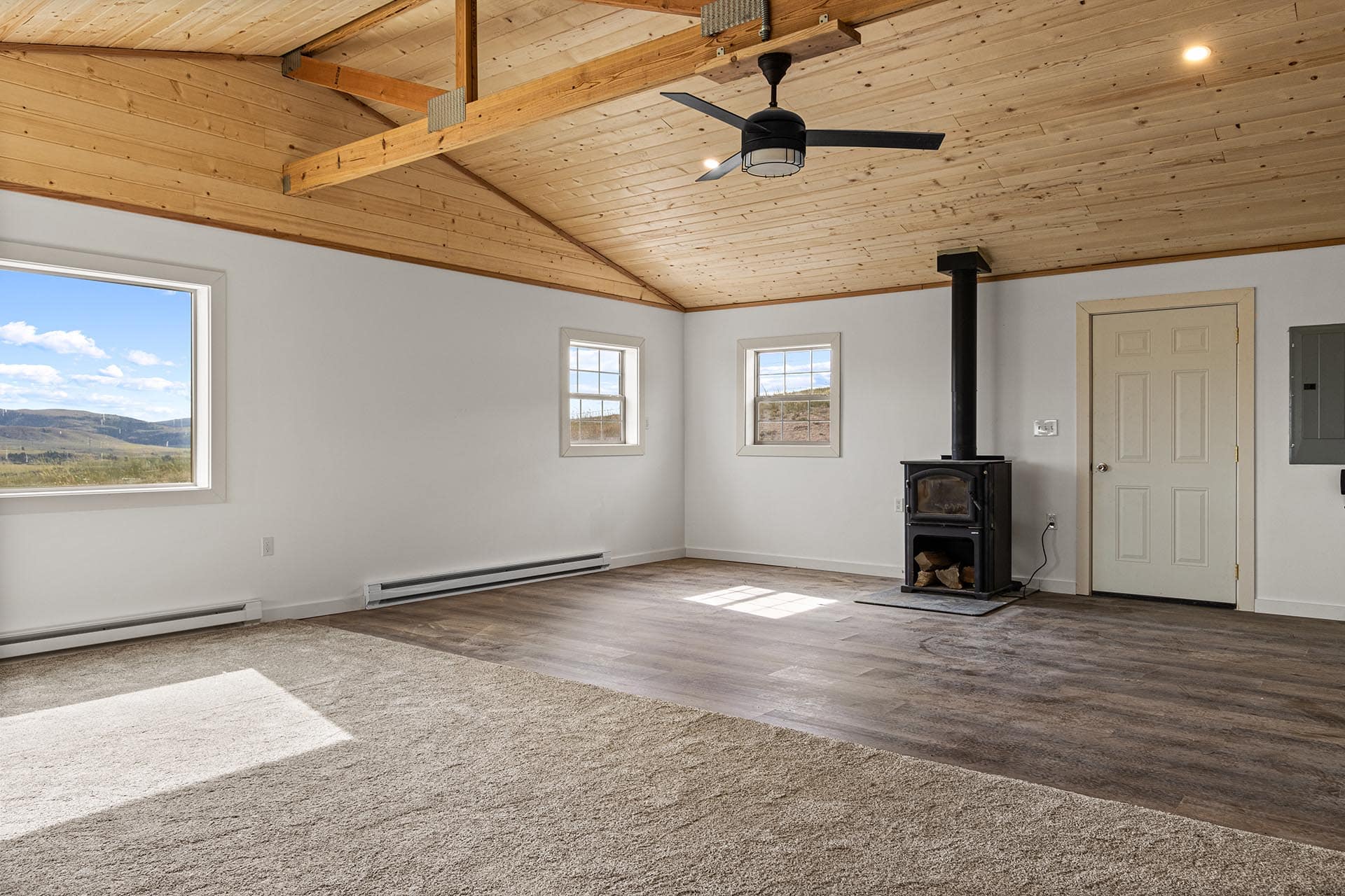 living area with wood burning stove montana pintler views retreat