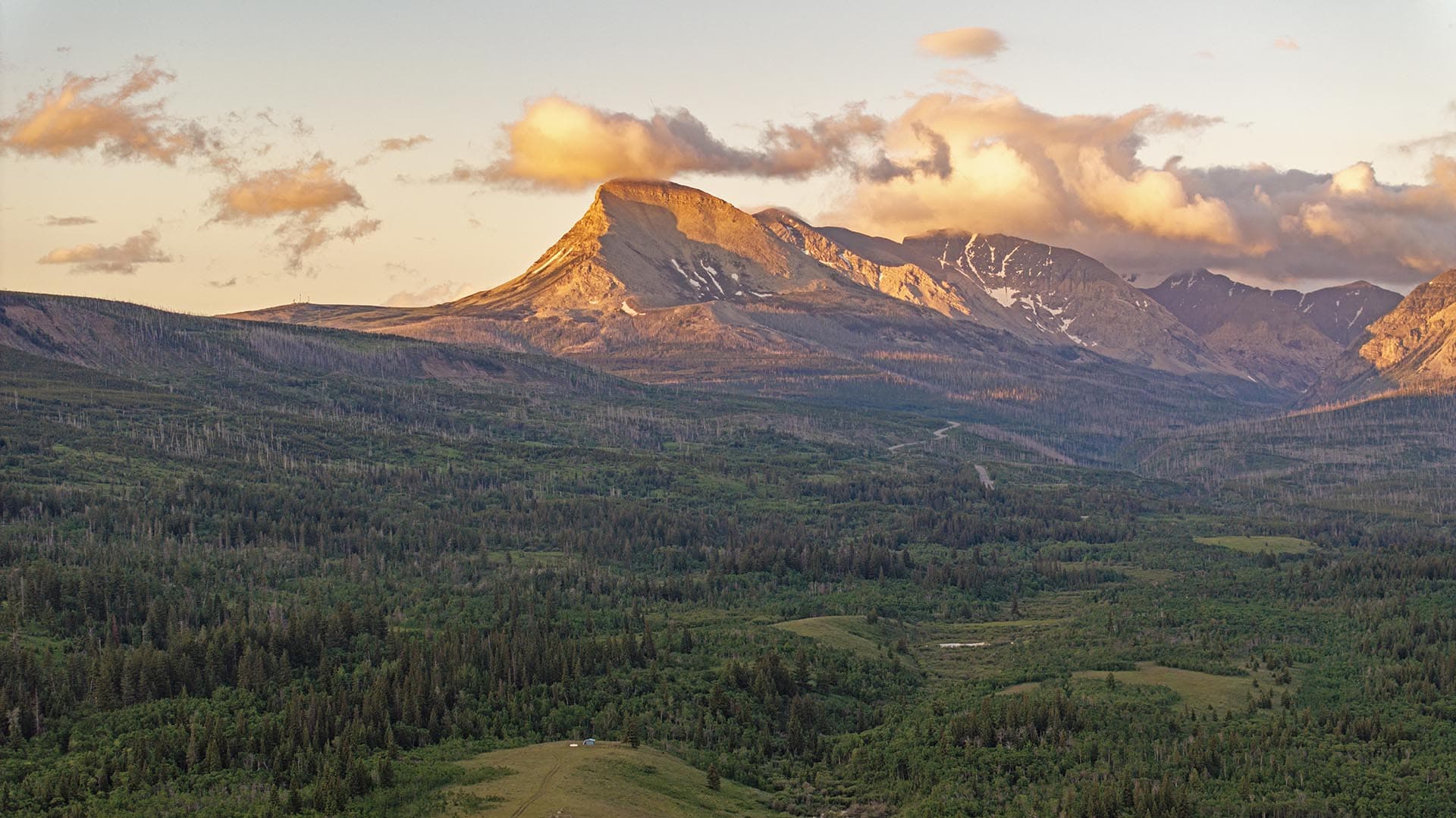 sunlit mountain peak land montana st. mary overlook