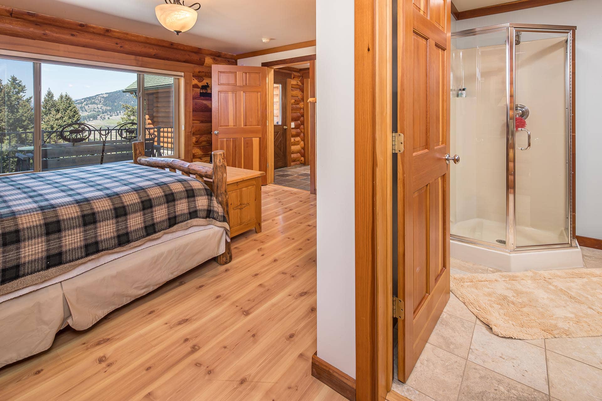 bedroom with balcony access montana elk ranch