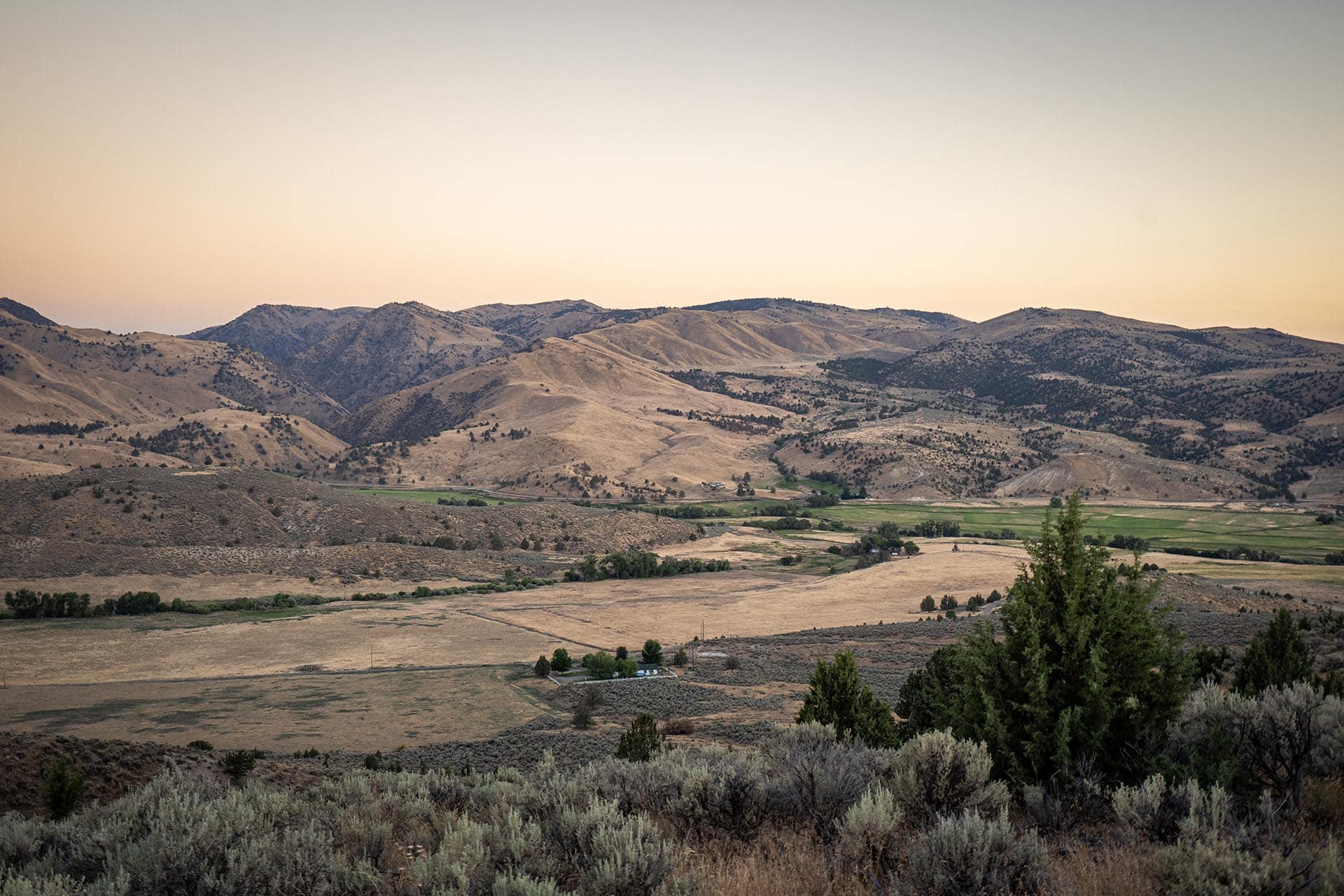 distant ranch buildings valley view hunting sporting for sale oregon powell creek ranch