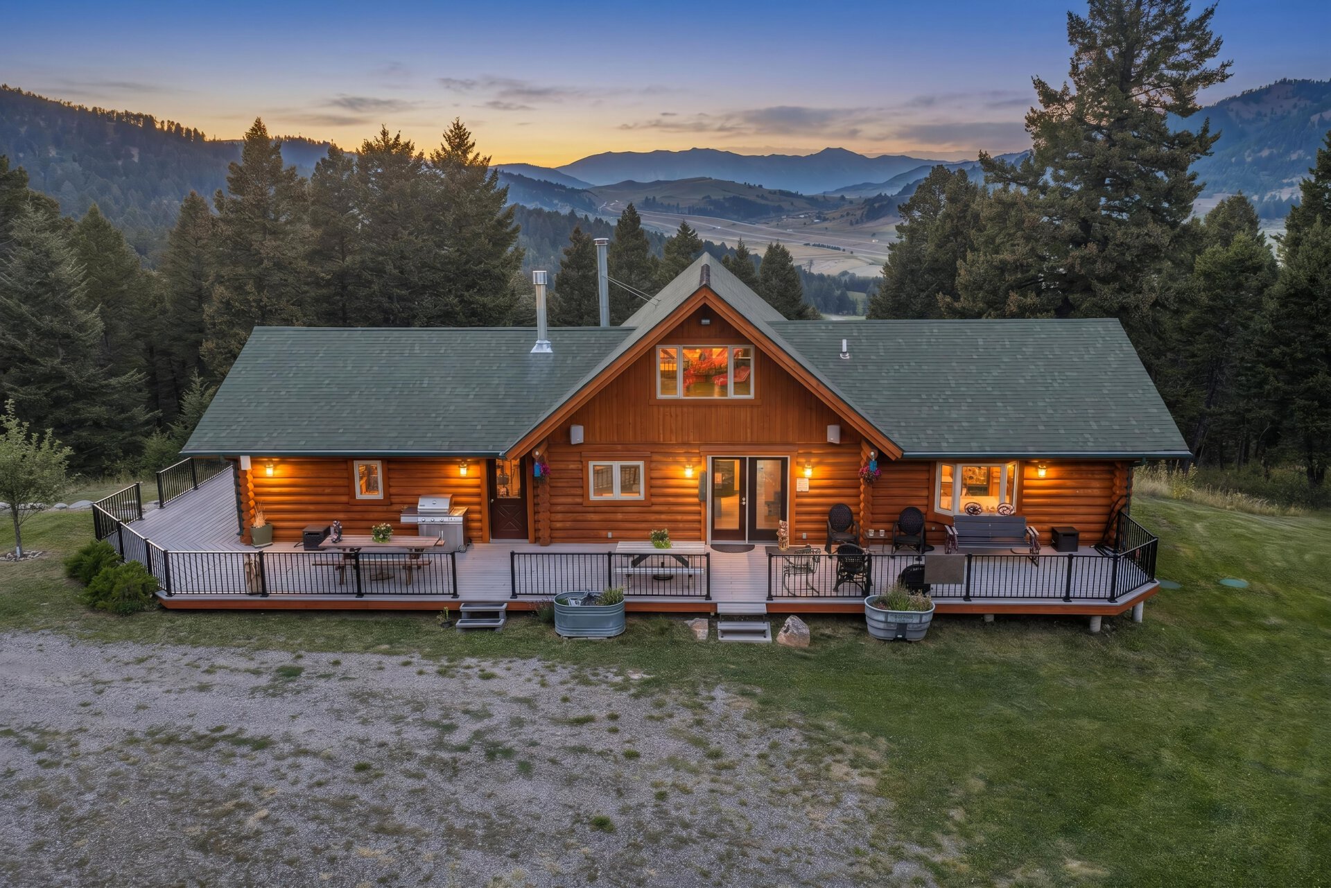 log home exterior with large deck montana elk ranch