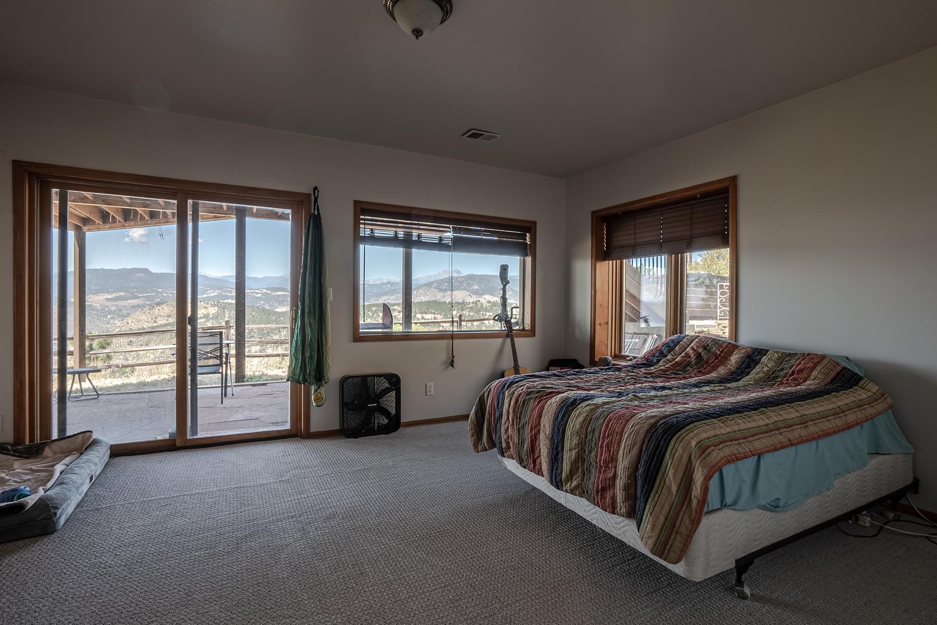 master bedroom with patio access property colorado boulder county vistas