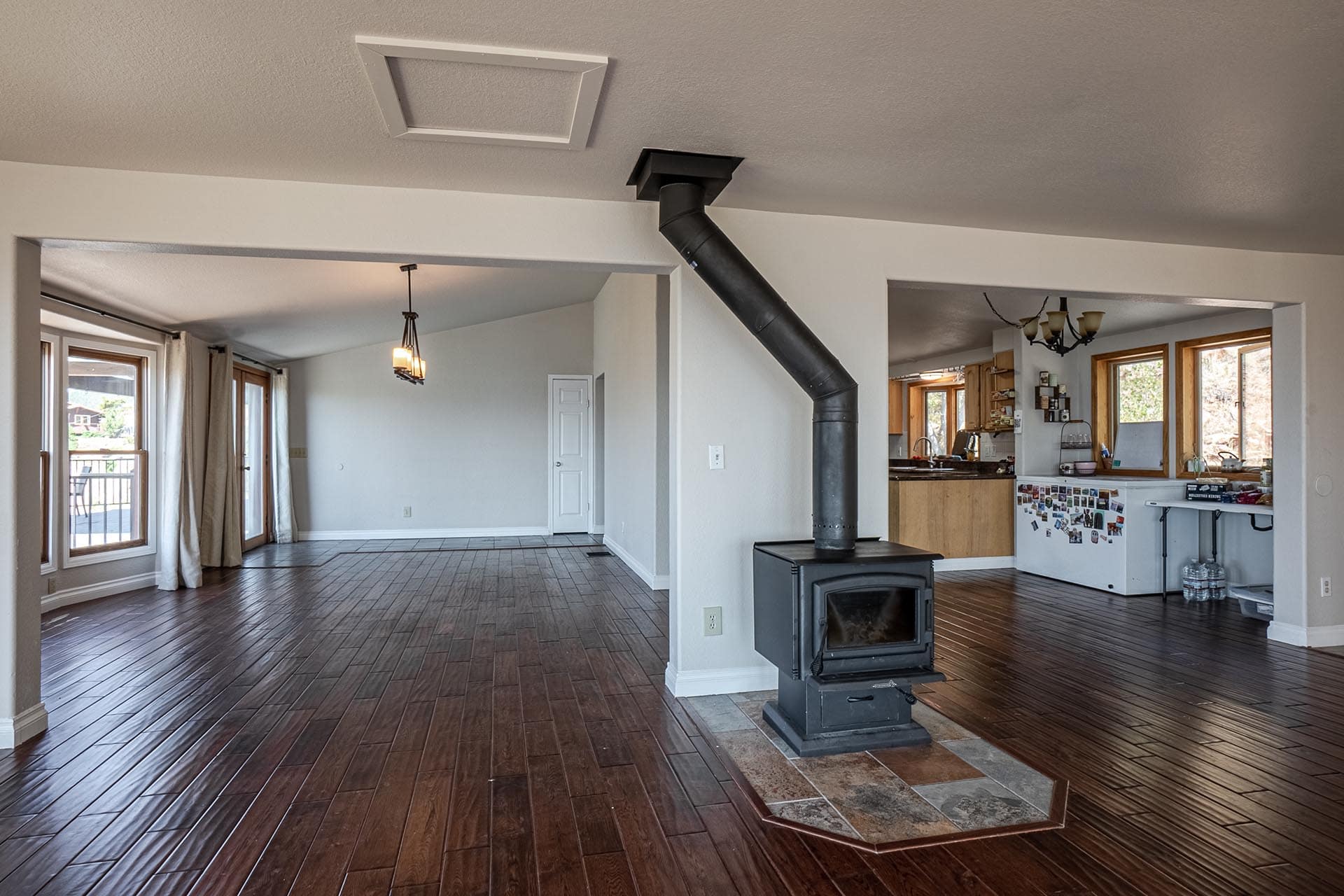 open concept living room with wood stove colorado boulder county vistas