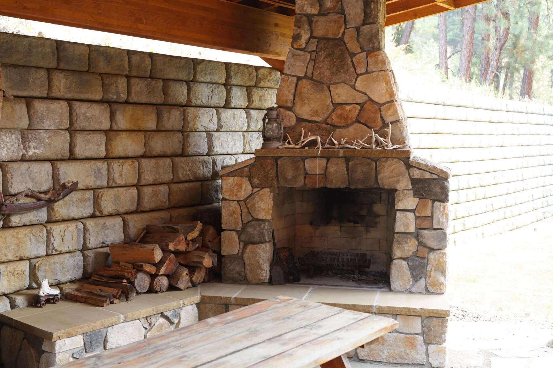 outdoor stone fireplace with firewood idaho little salmon river lodge
