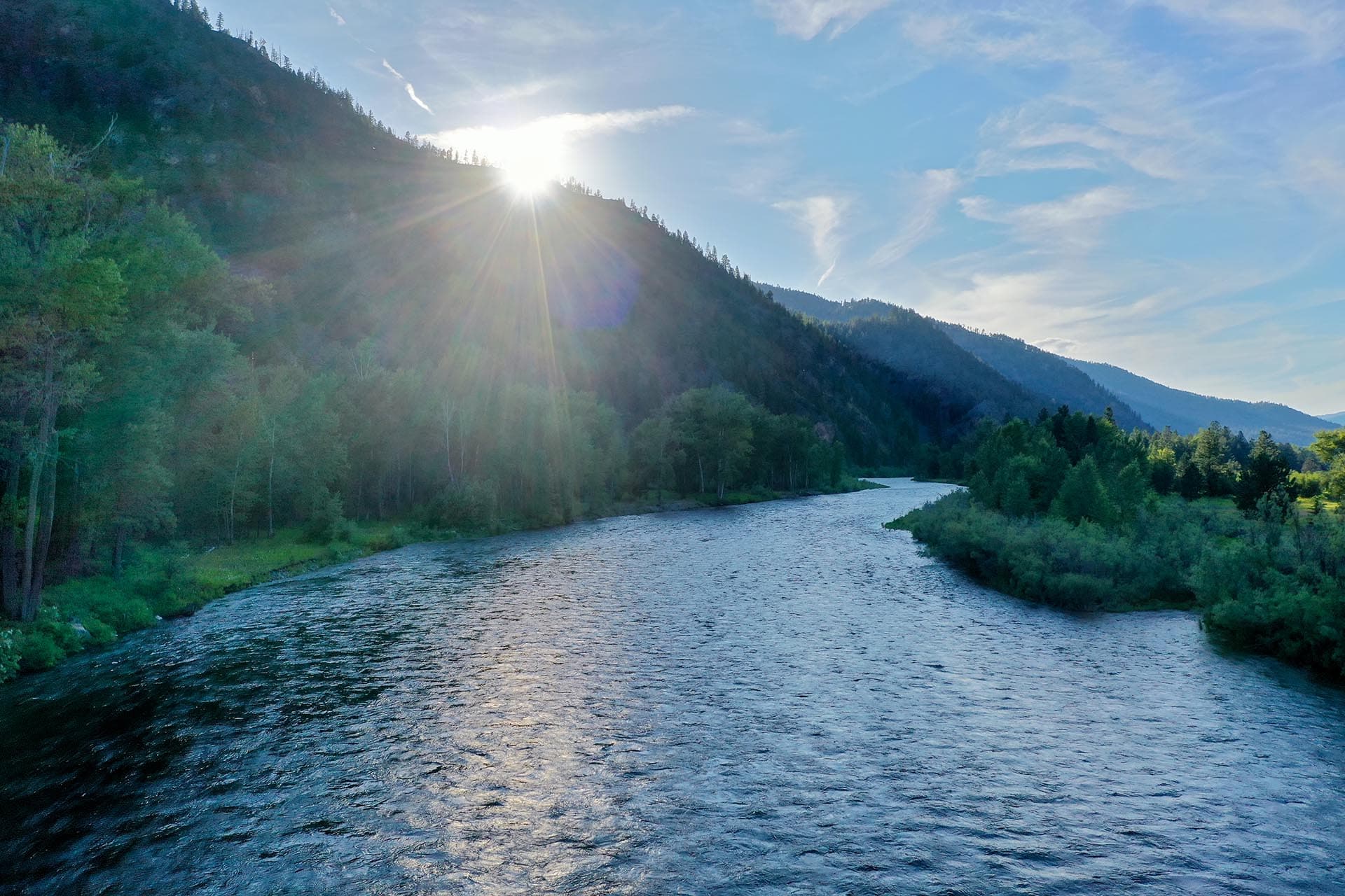 sun setting on the clark fork montana rock clark ranch