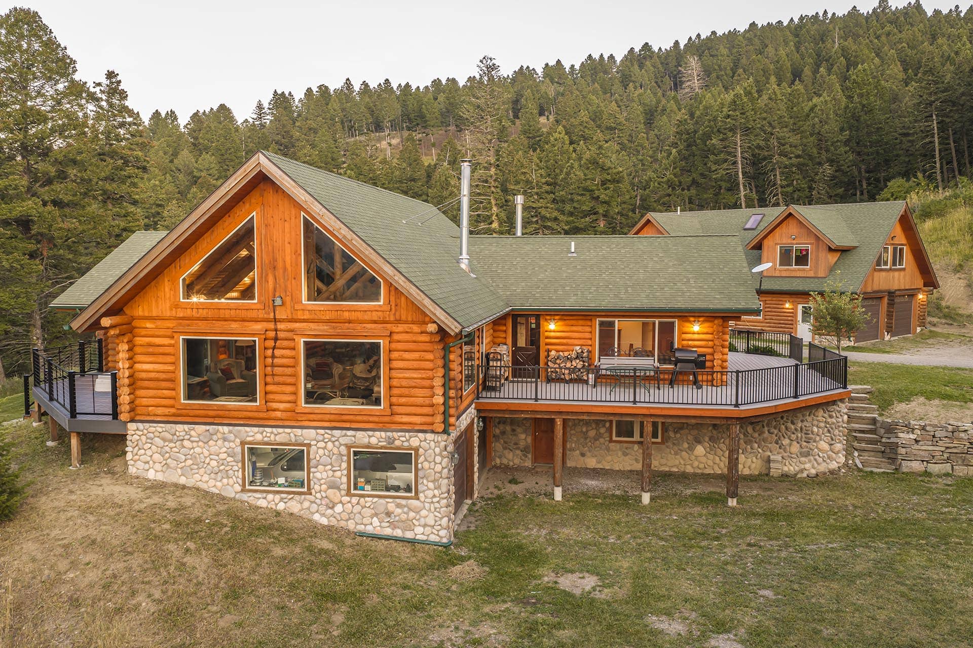 timbered land with log house montana elk ranch