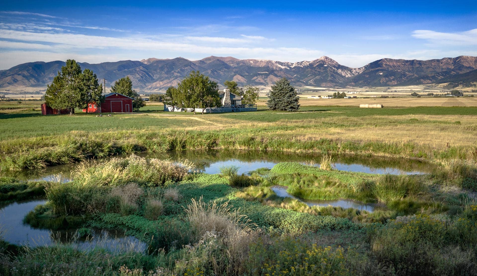 wetland pond property with farm buildings montana east gallatin riverlands