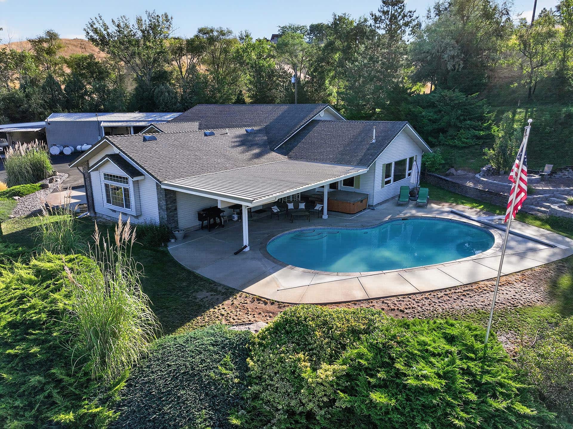 aerial view custom home pool and shop idaho apple ridge farmstead