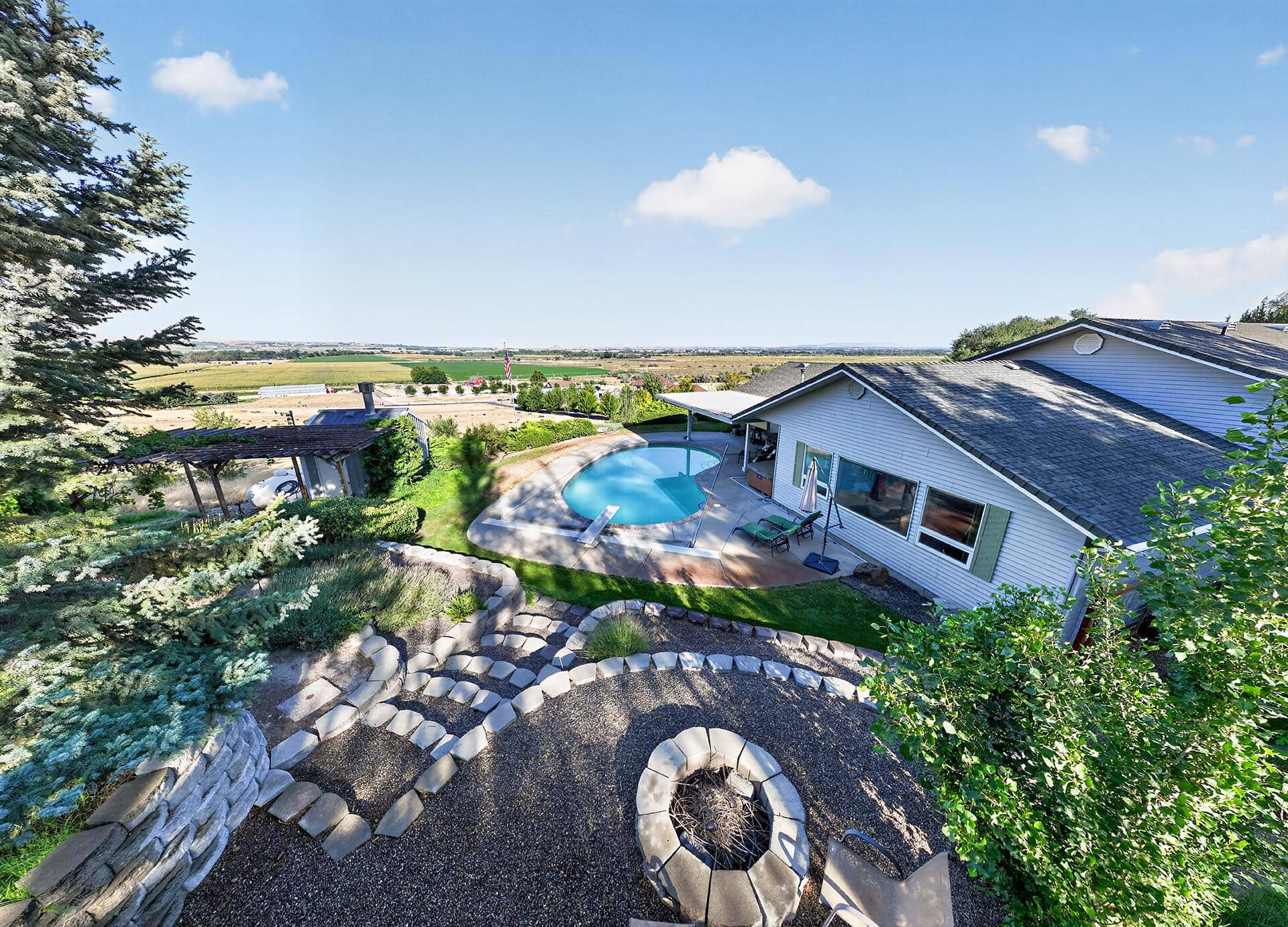 backyard pool and patio with american flag idaho apple ridge farmstead