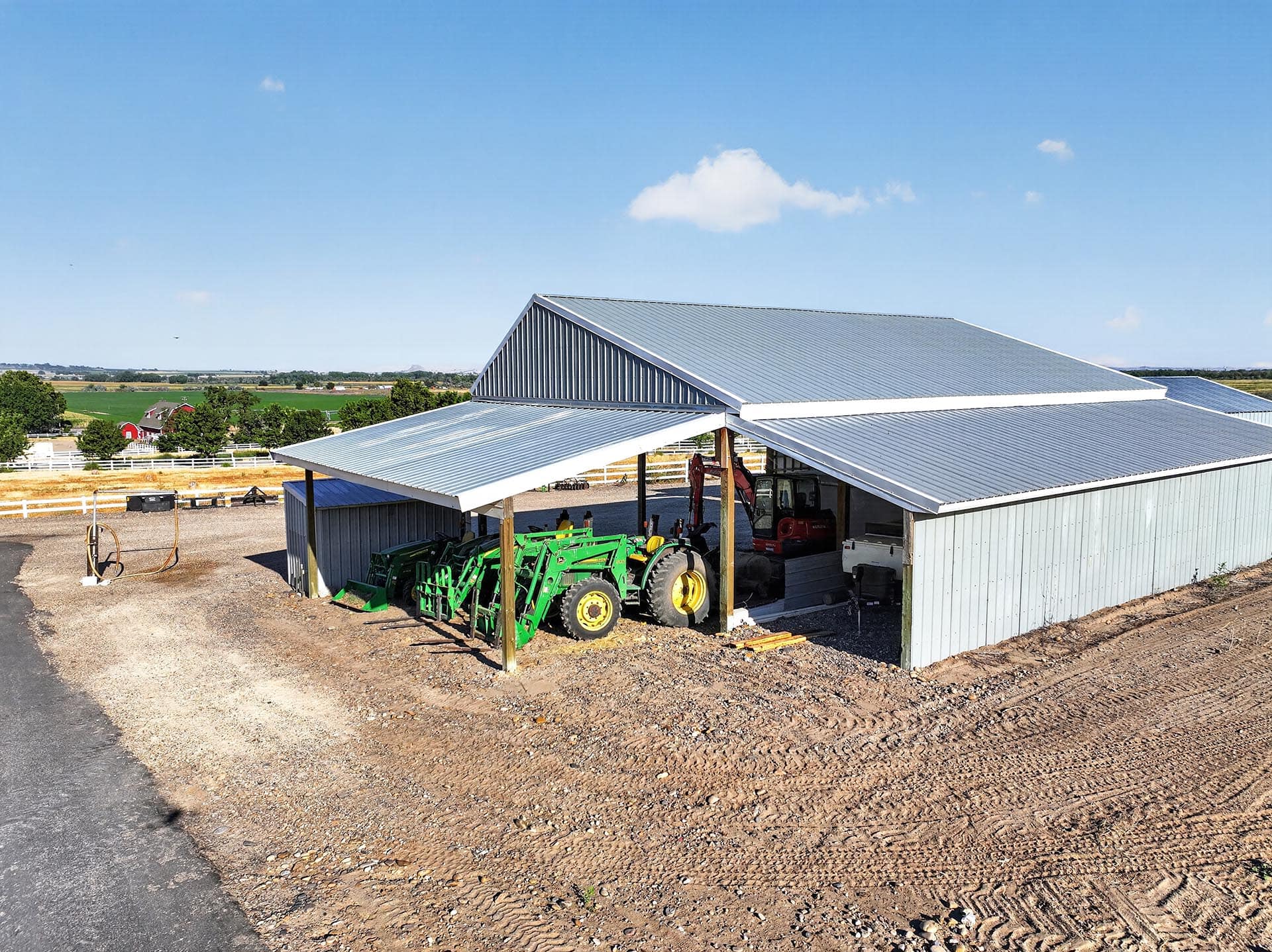 farm equipment shed with tractor and valley view idaho apple ridge farmstead