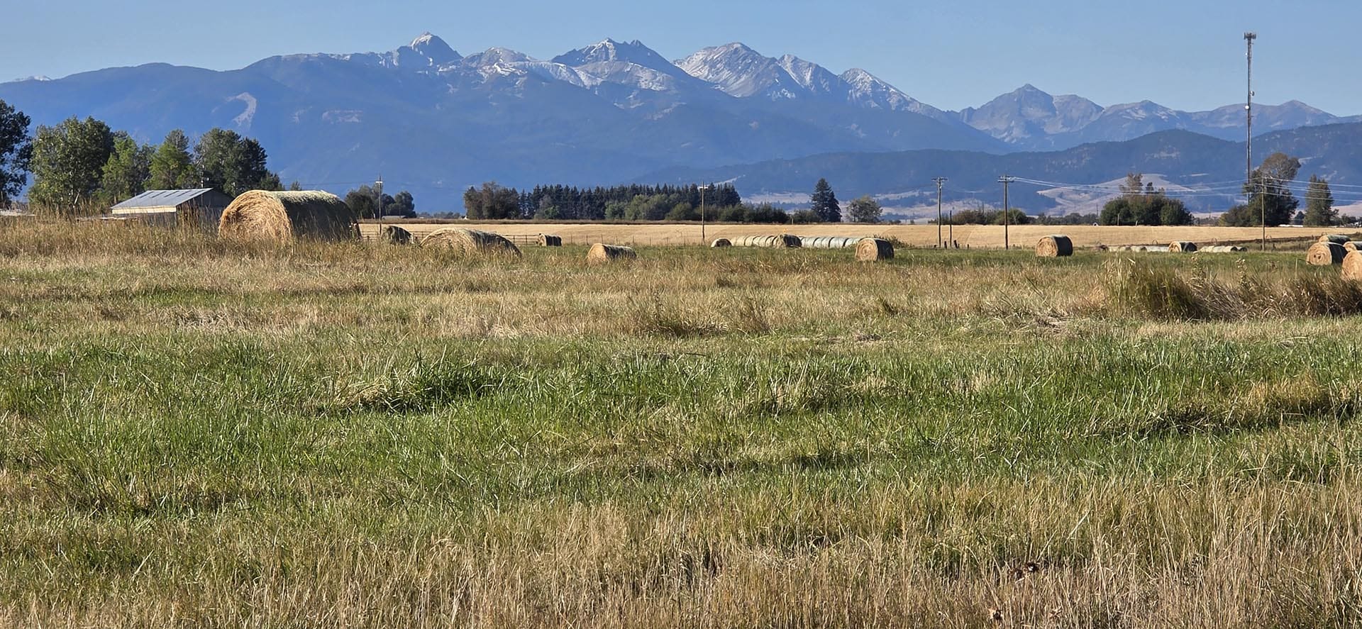 farm land with hay bales and mountain views montana west bozeman homestead