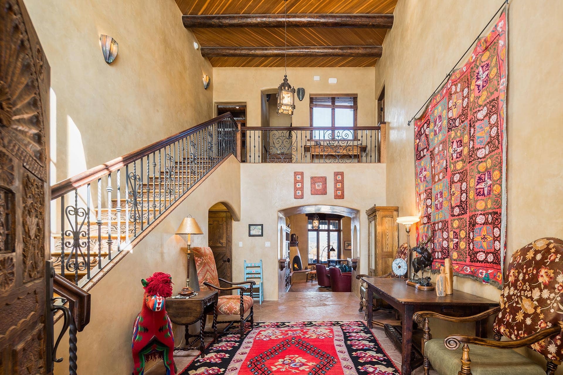grand entryway with elegant staircase new mexico hacienda de suenos