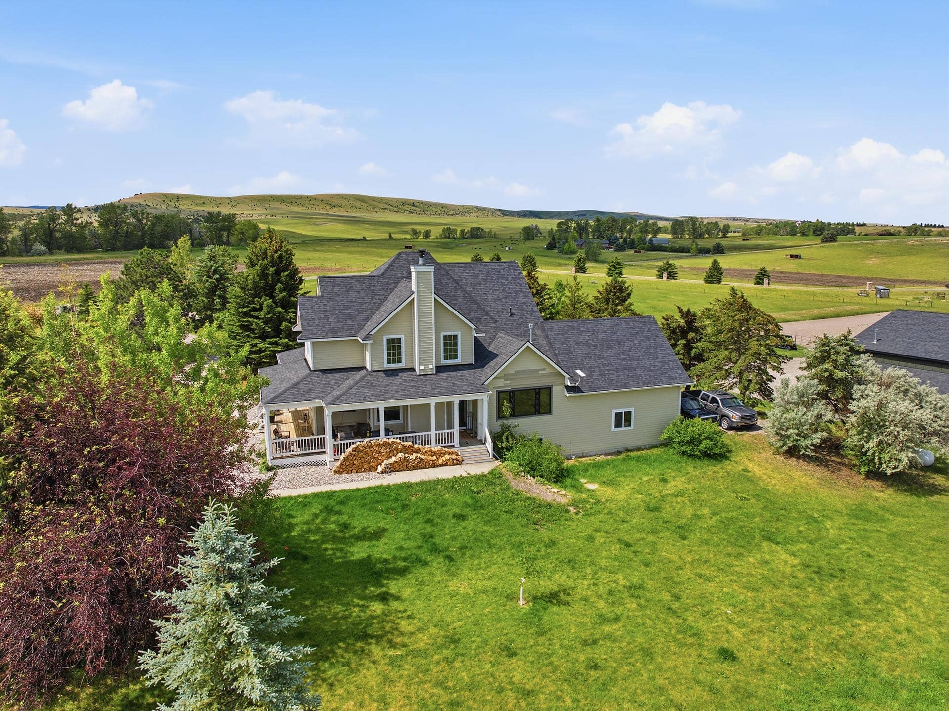 home exterior with green pastures montana trailcrest horse property