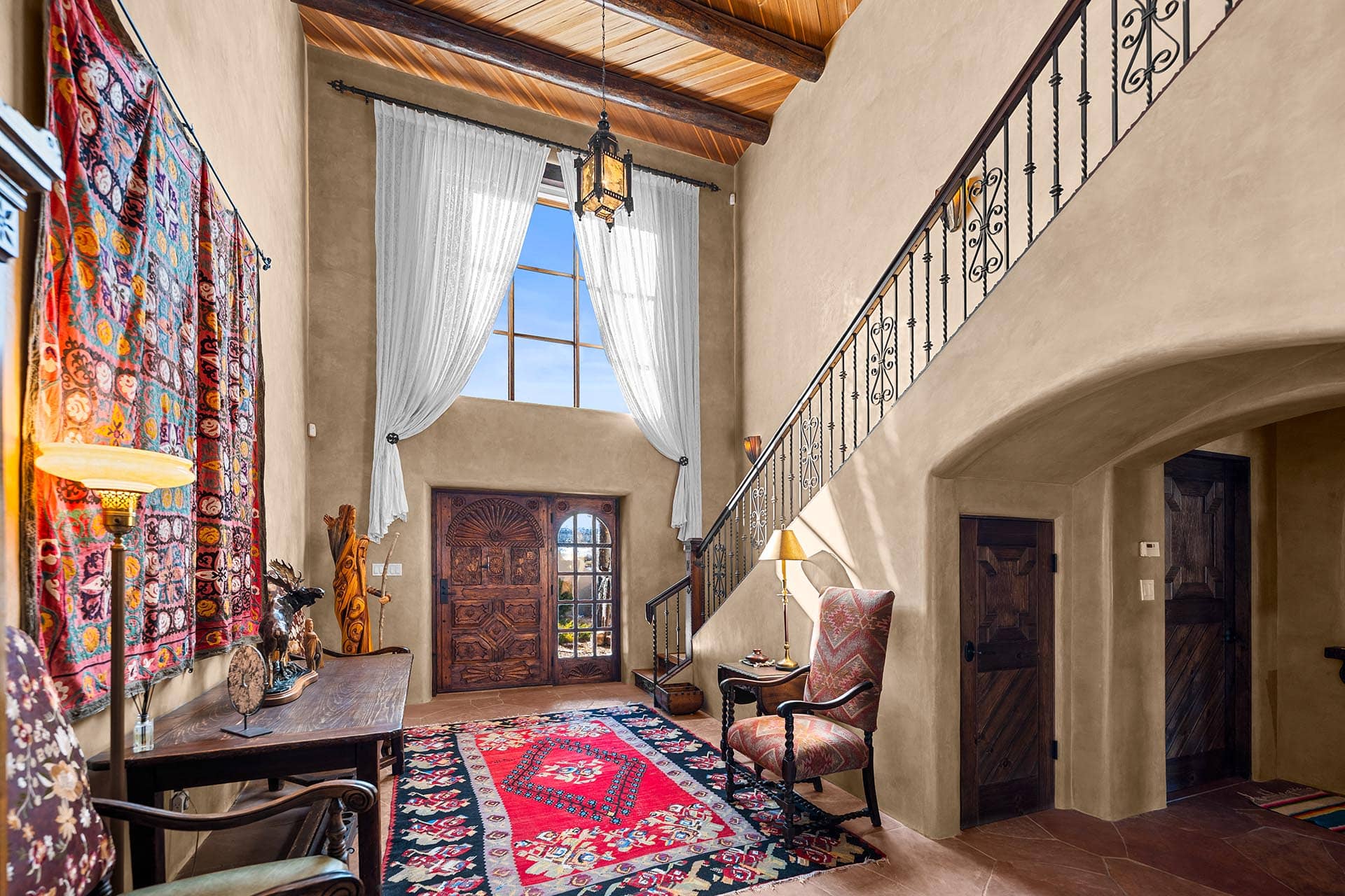 luxury home entry with wood beam ceiling new mexico hacienda de suenos