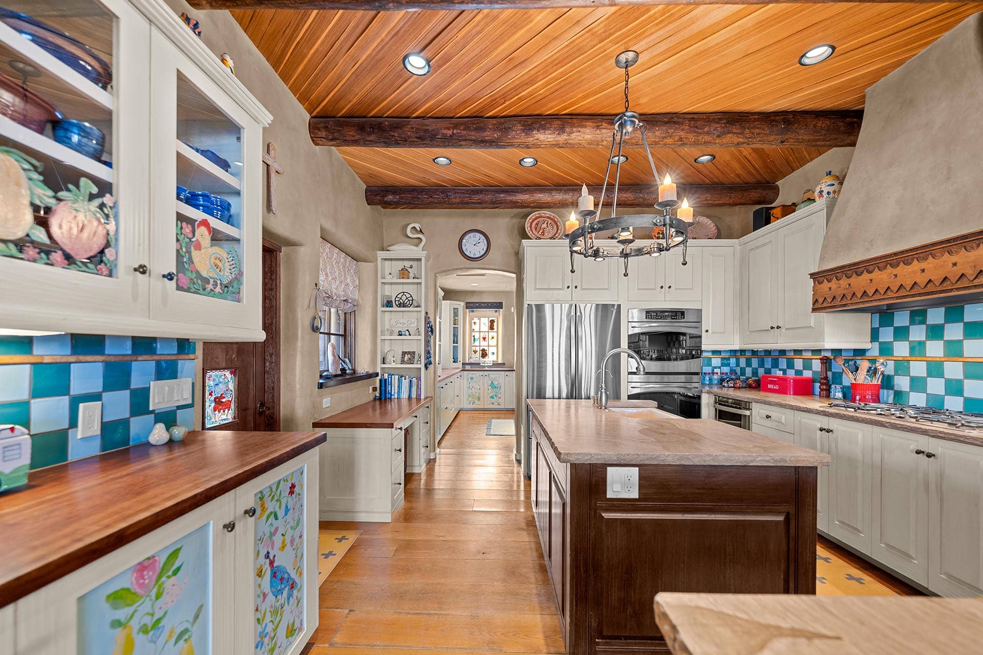 luxury kitchen with colorful tile and wood beams new mexico hacienda de suenos