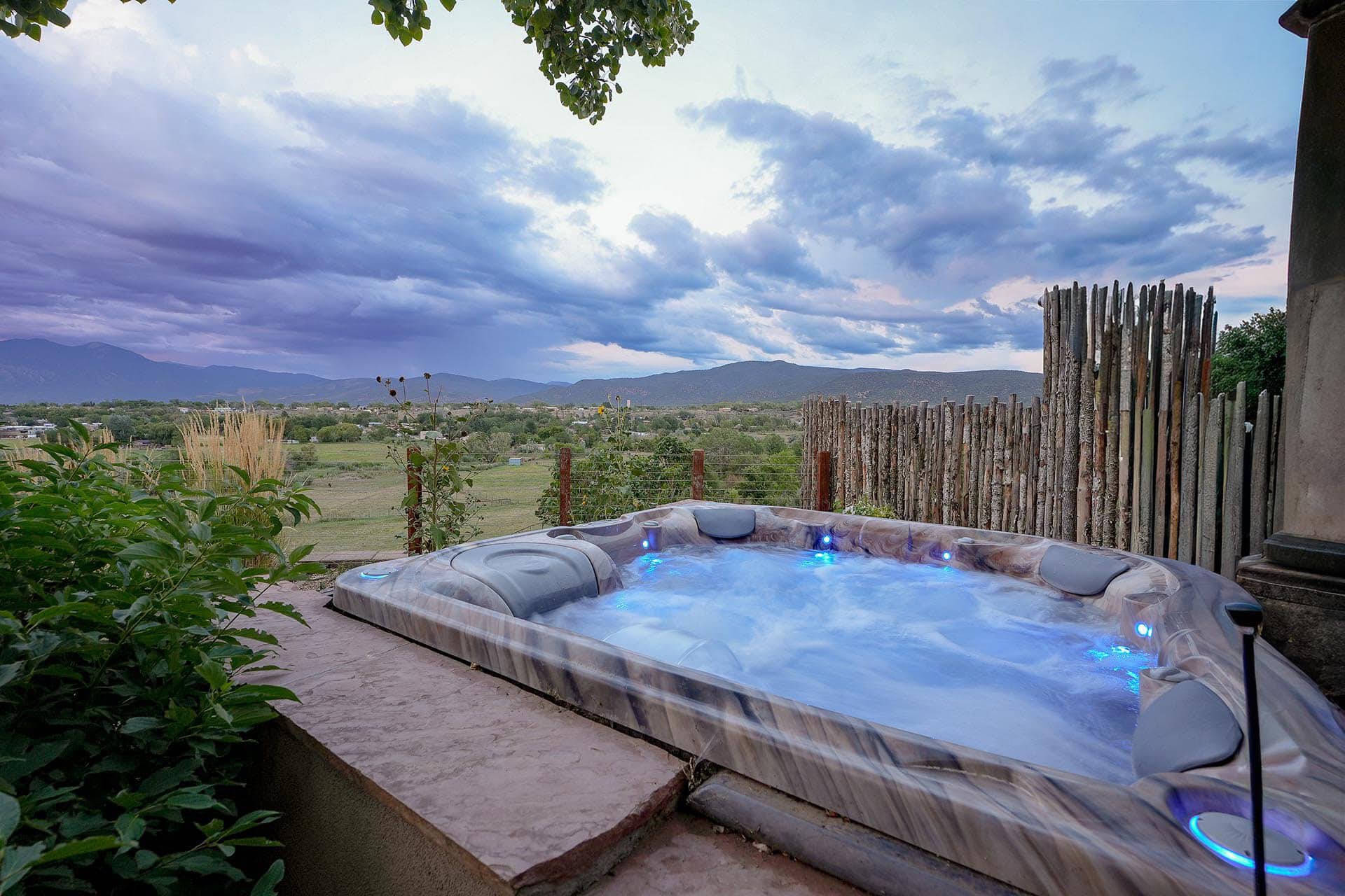 outdoor hot tub with scenic mountain views new mexico hacienda de suenos