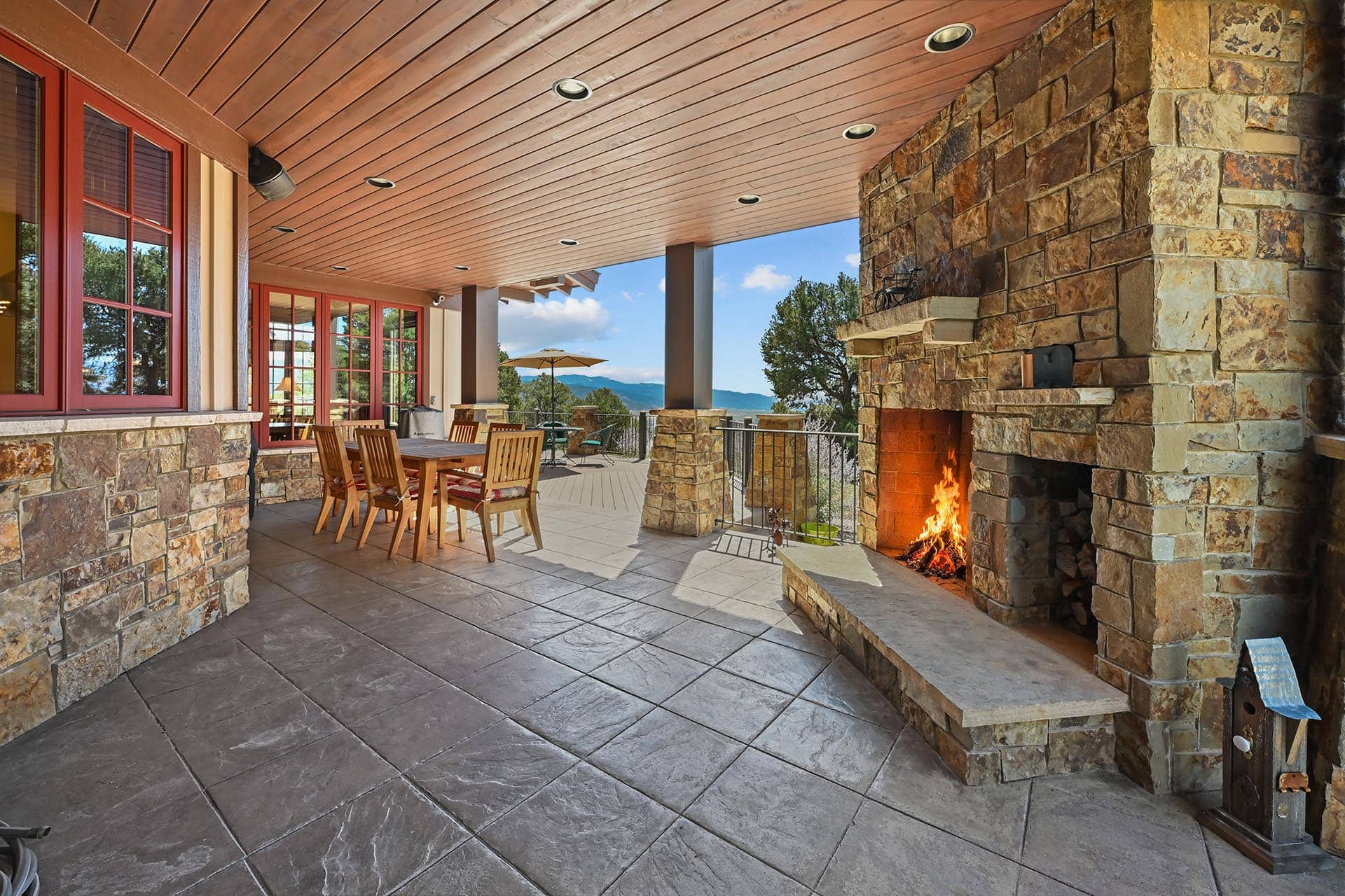 outdoor stone fireplace patio residential estate colorado collegiate peaks ranch
