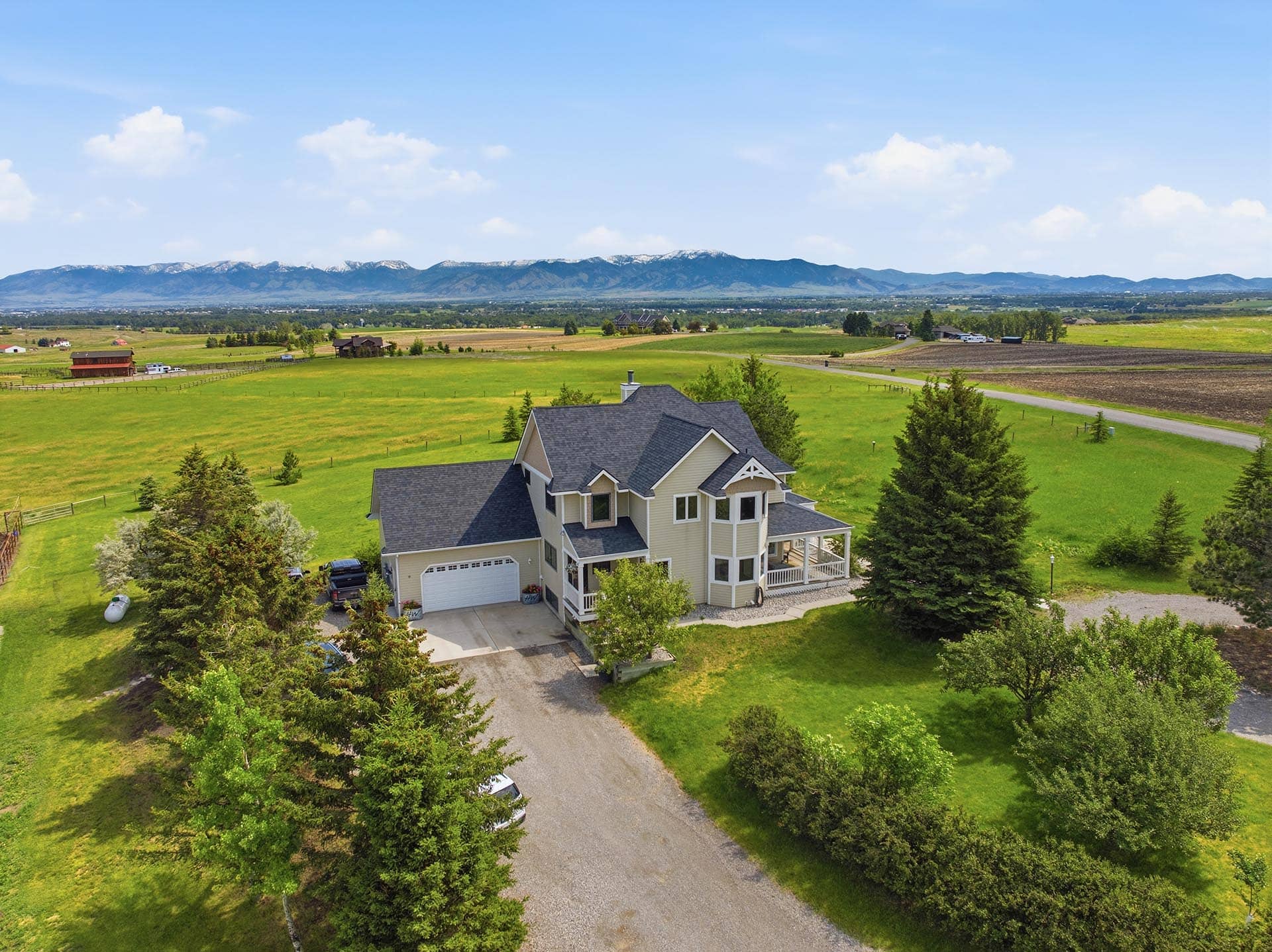 residential home with mountain views and driveway montana trailcrest horse property
