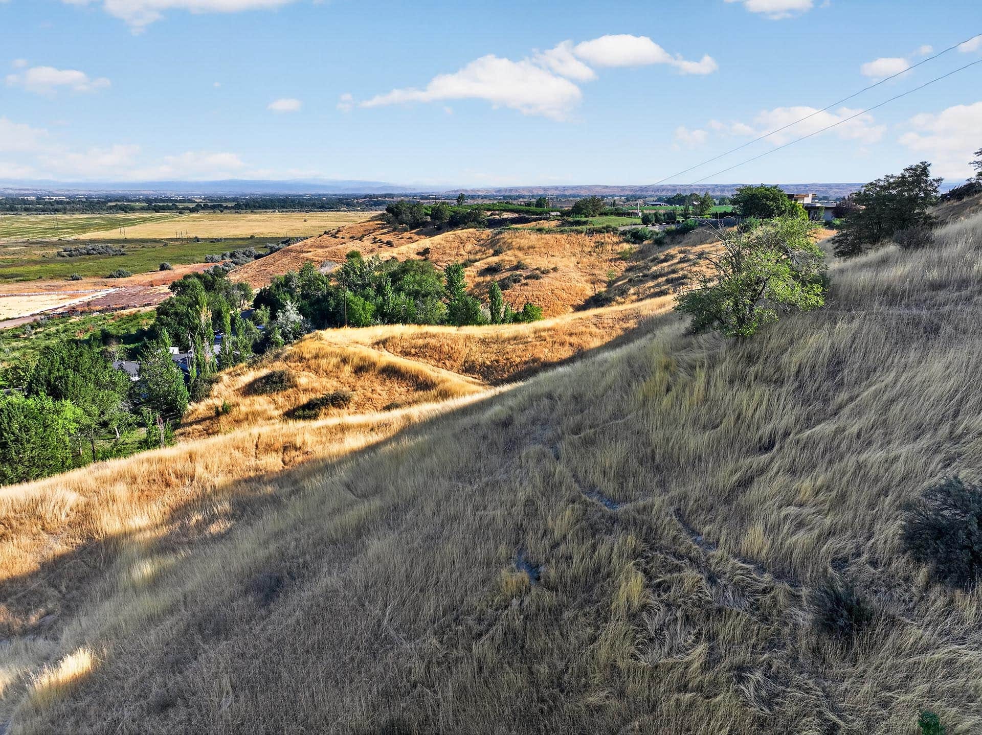 rolling hillside pasture with valley views idaho apple ridge farmstead