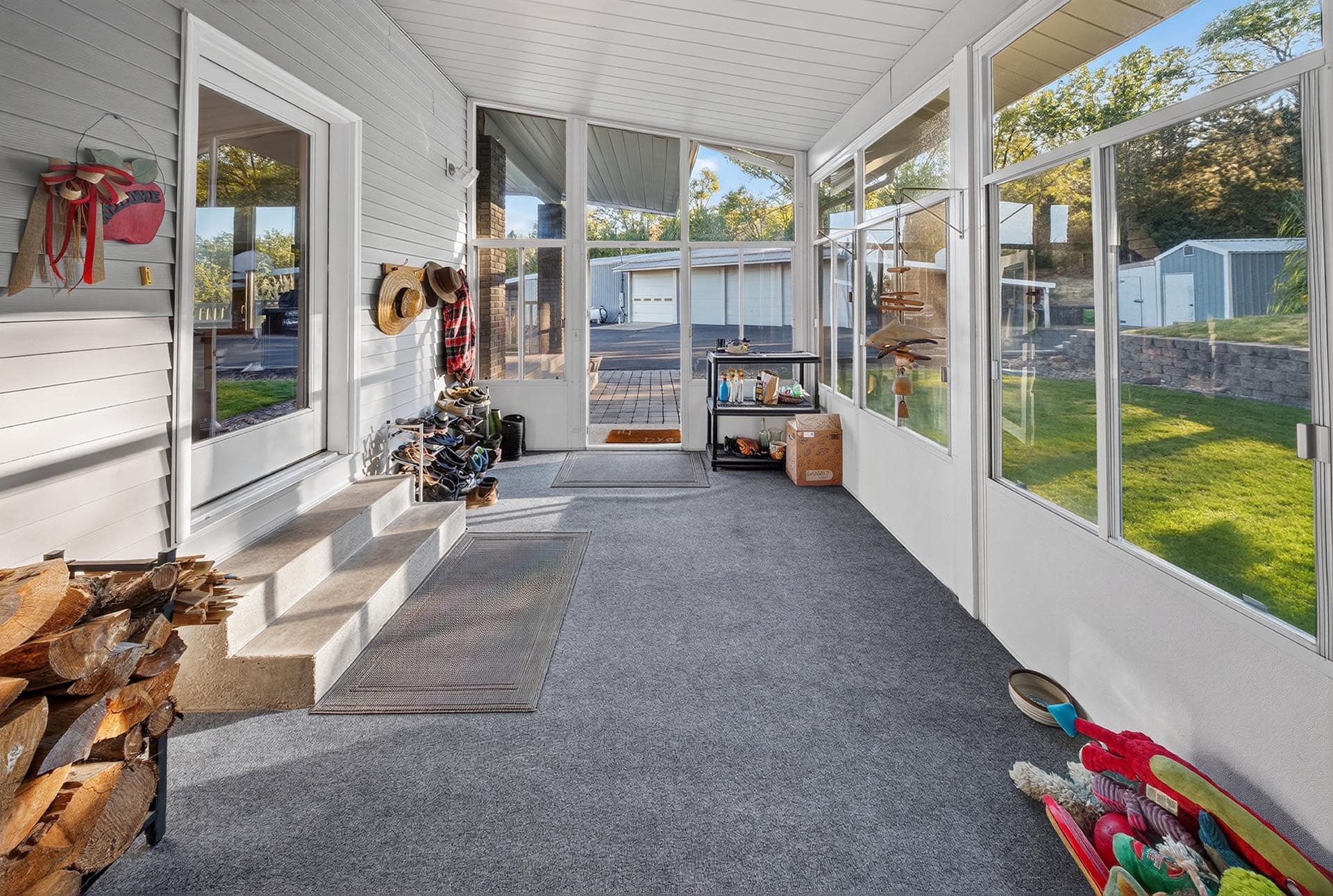 screened porch mudroom with firewood storage idaho apple ridge farmstead