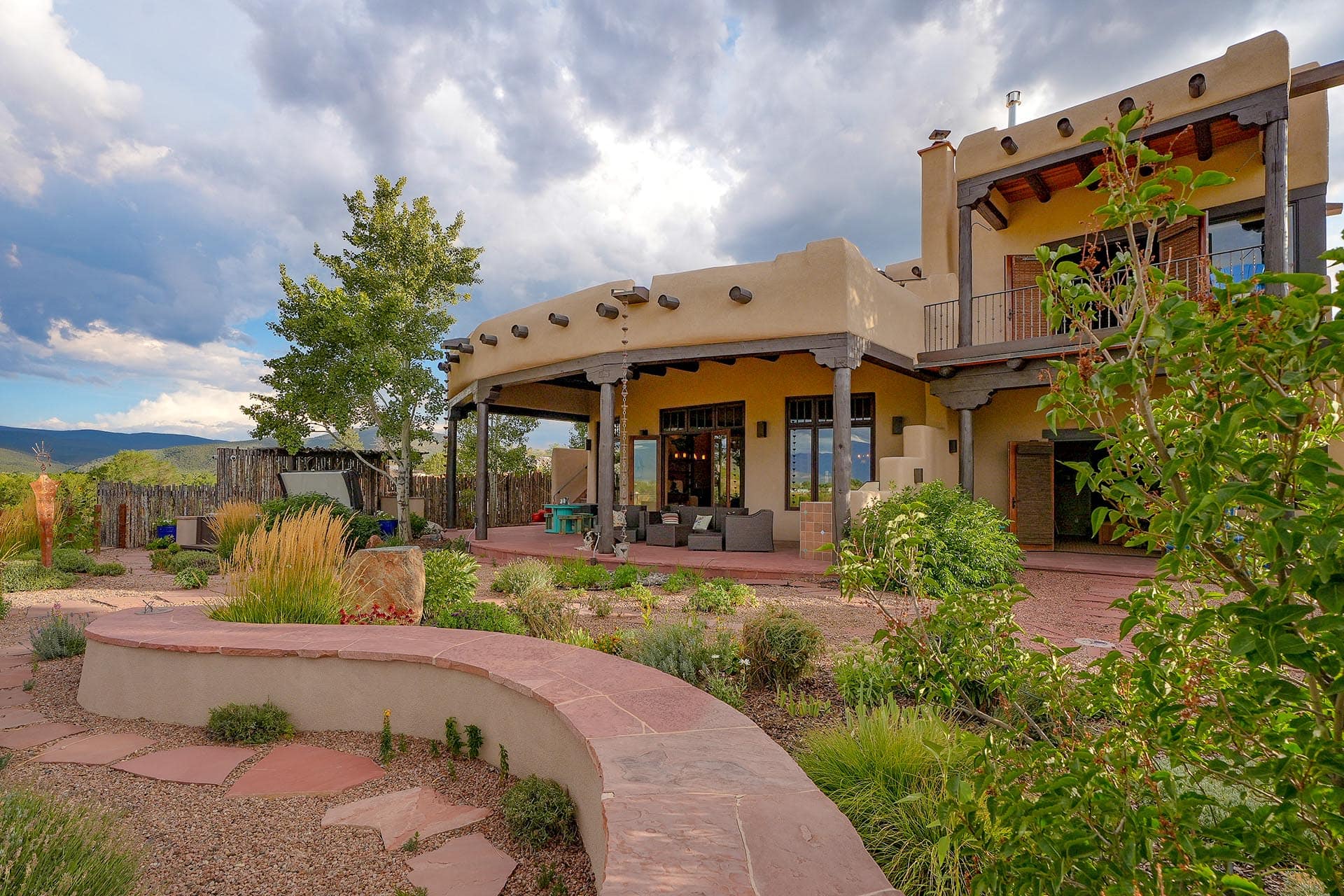southwest style home exterior with landscaped garden new mexico hacienda de suenos