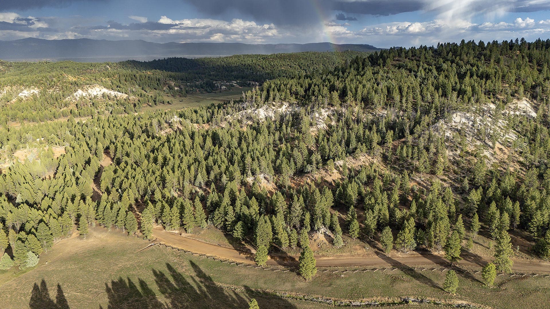 timbered hillsides with rainbow raw land utah elk ridge estates