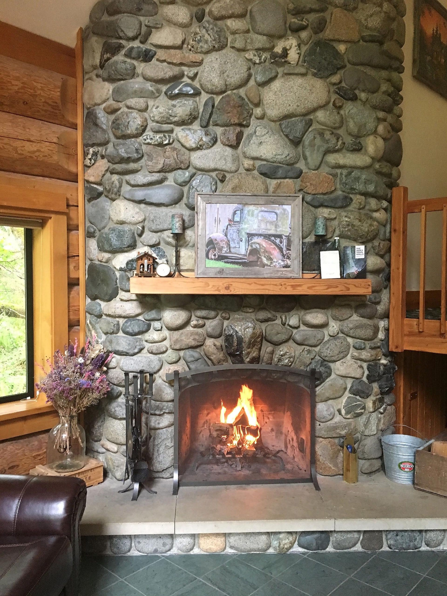 custom log home with river rock fireplace washington sky river lodge