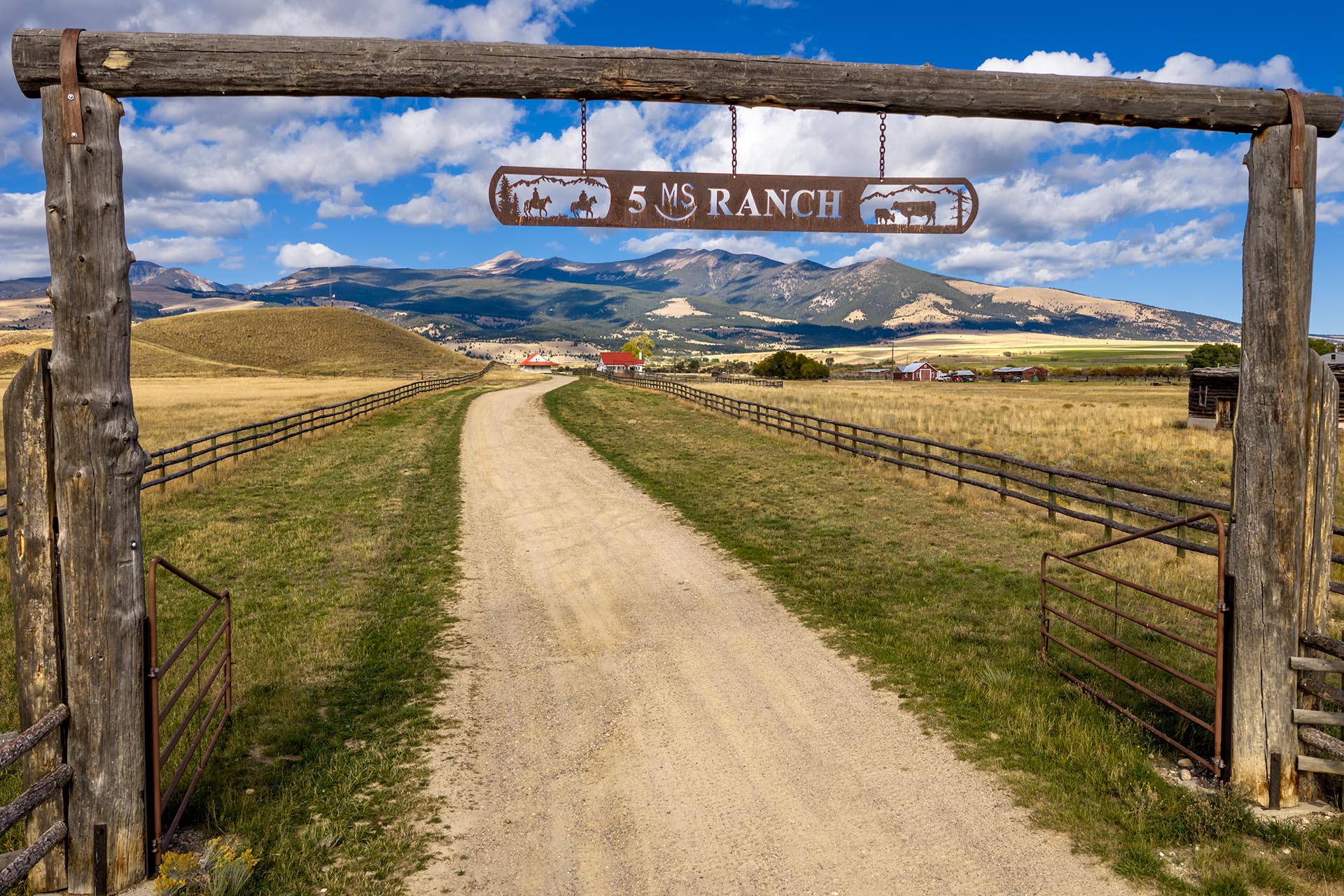 gated ranch entrance with long driveway land montana dempsey lakes cattle ranch