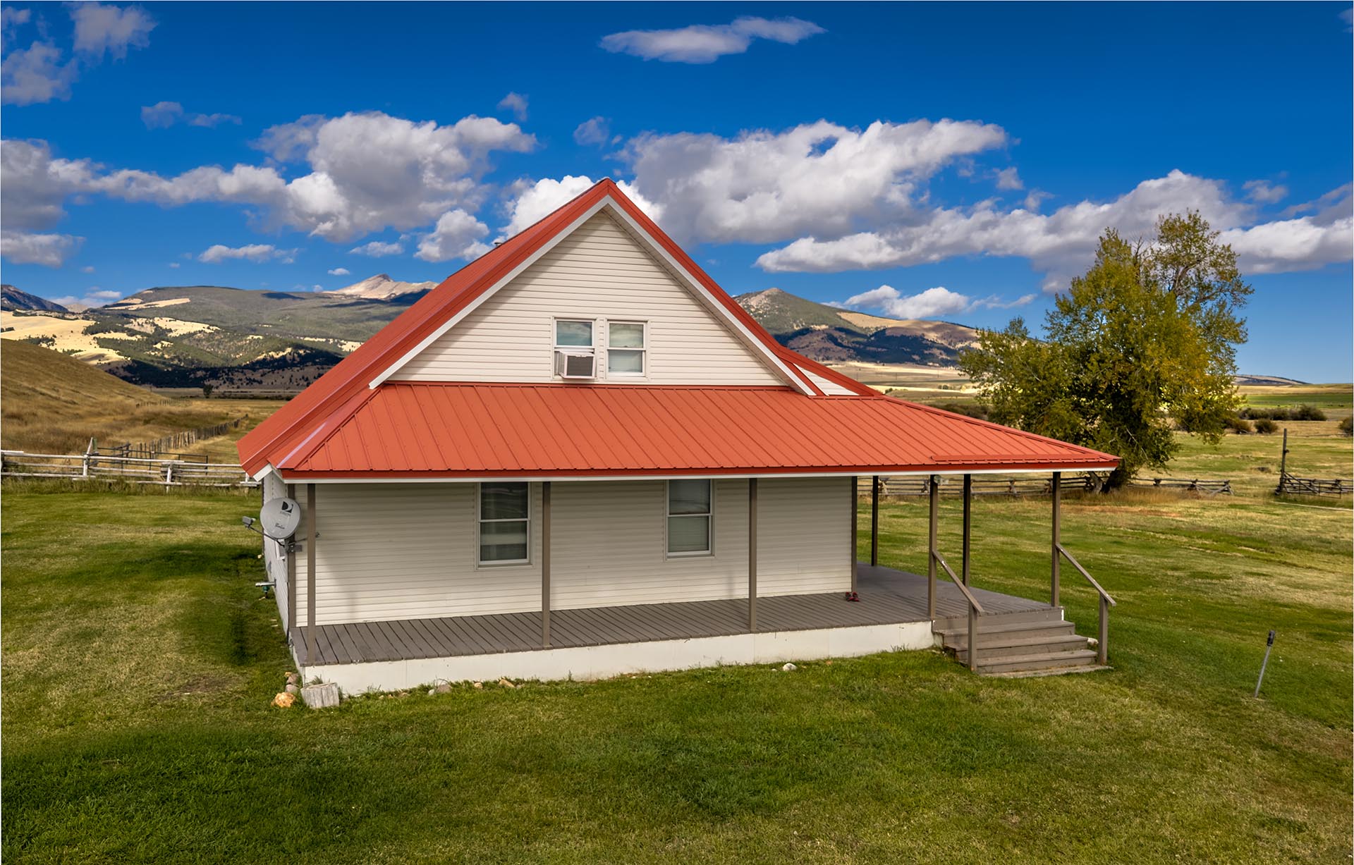 ranch house with red roof and porch land for sale montana dempsey lakes cattle ranch