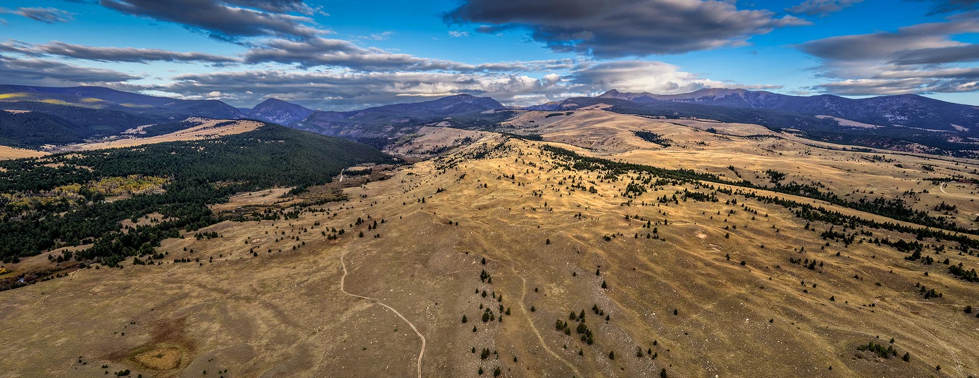 rugged land with stream frontage and mountain backdrop montana dempsey lakes cattle ranch
