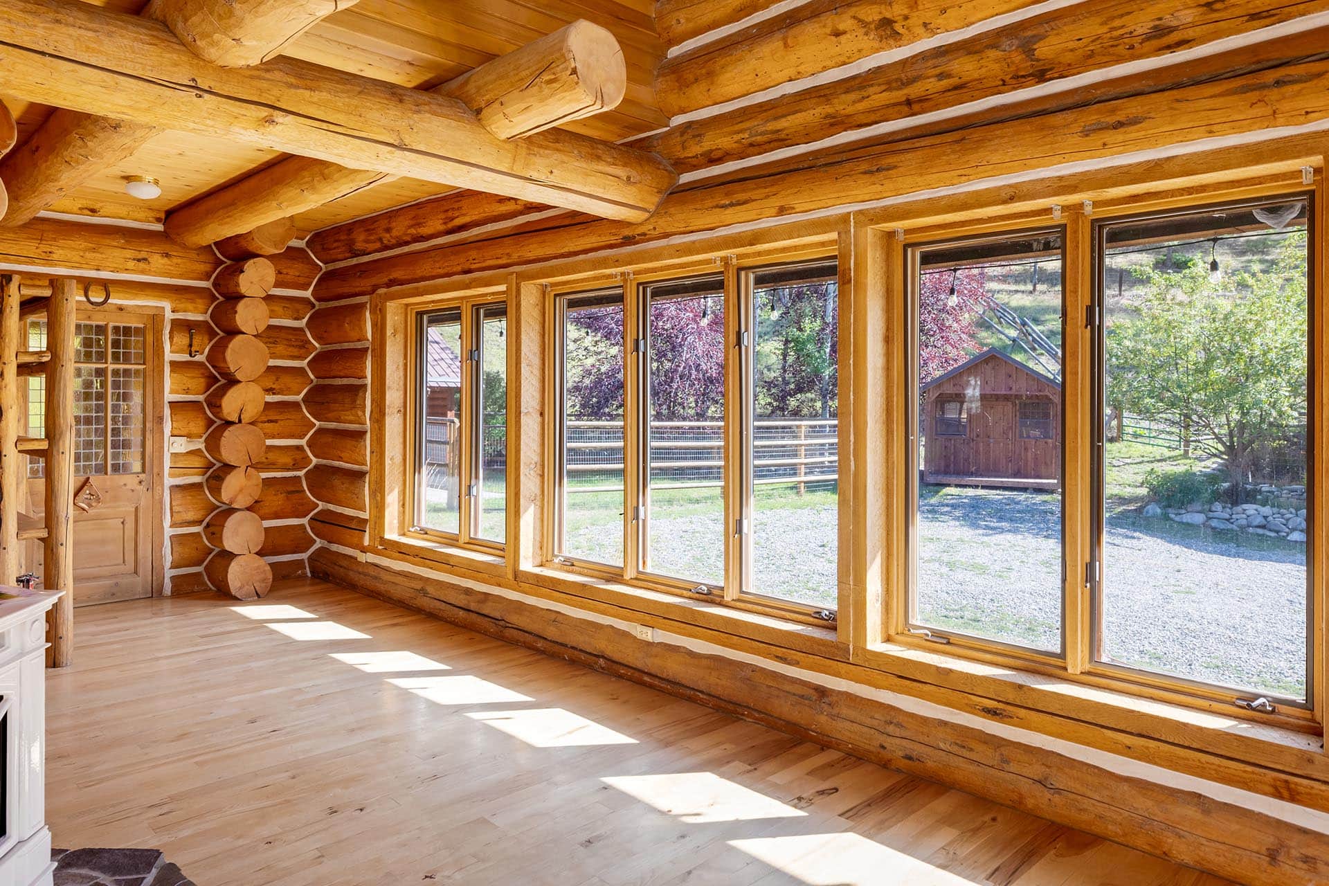 sunlit log cabin living room idaho north fork meadows
